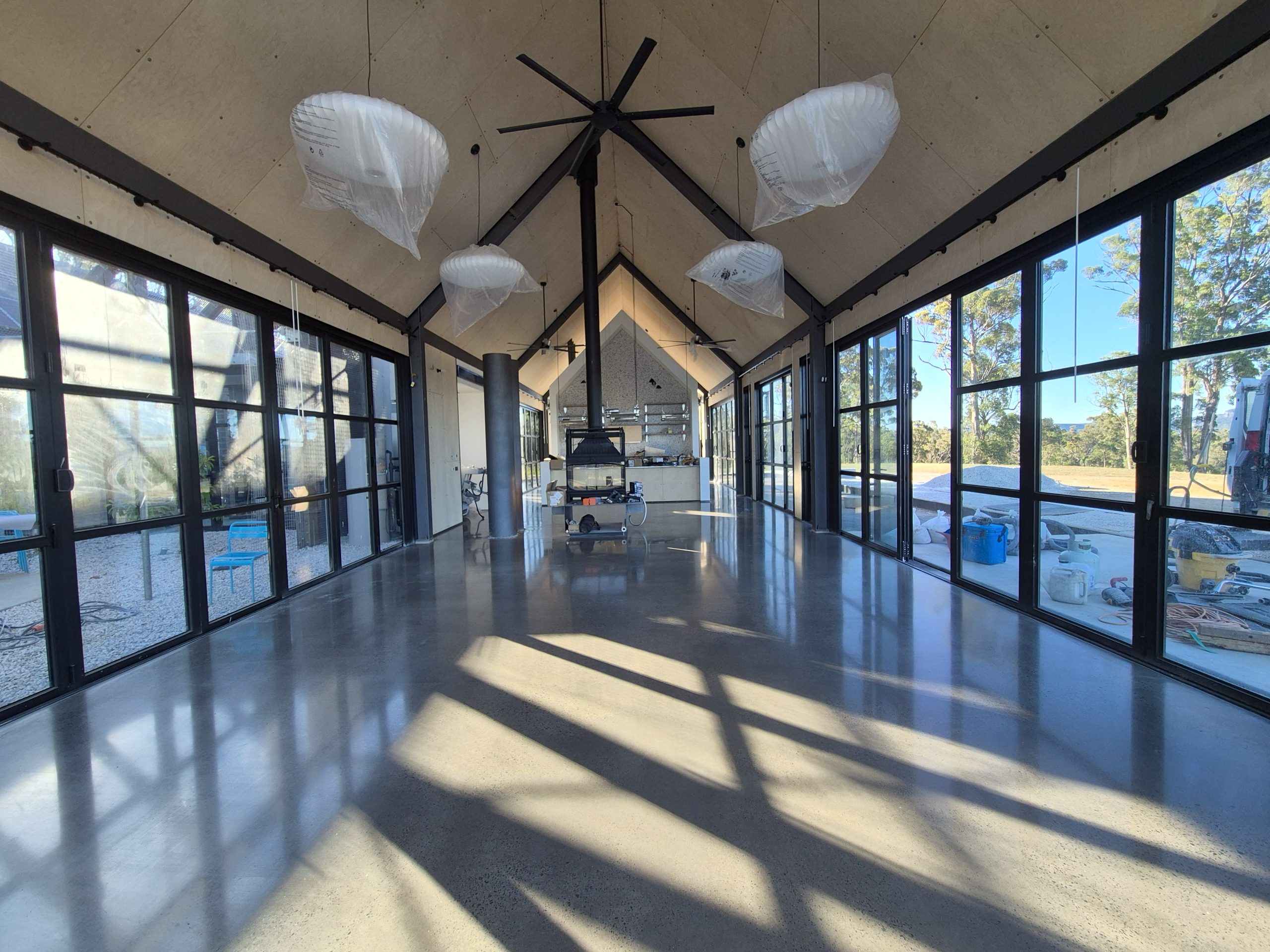 Matte satin 400 grit mechanically polished concrete indoor floor for a coastal residential property in Culburra Beach.