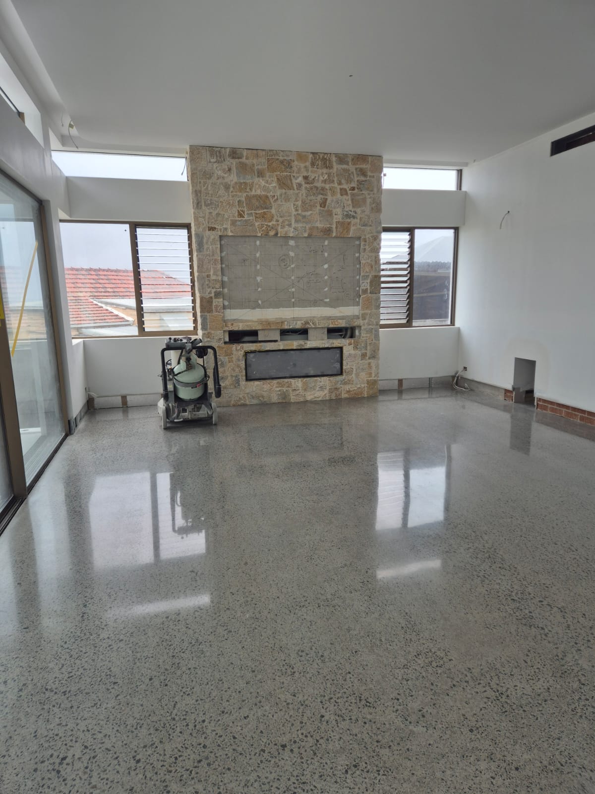 Matte satin 400 grit mechanically polished concrete indoor floor for a coastal residential property in Culburra Beach.