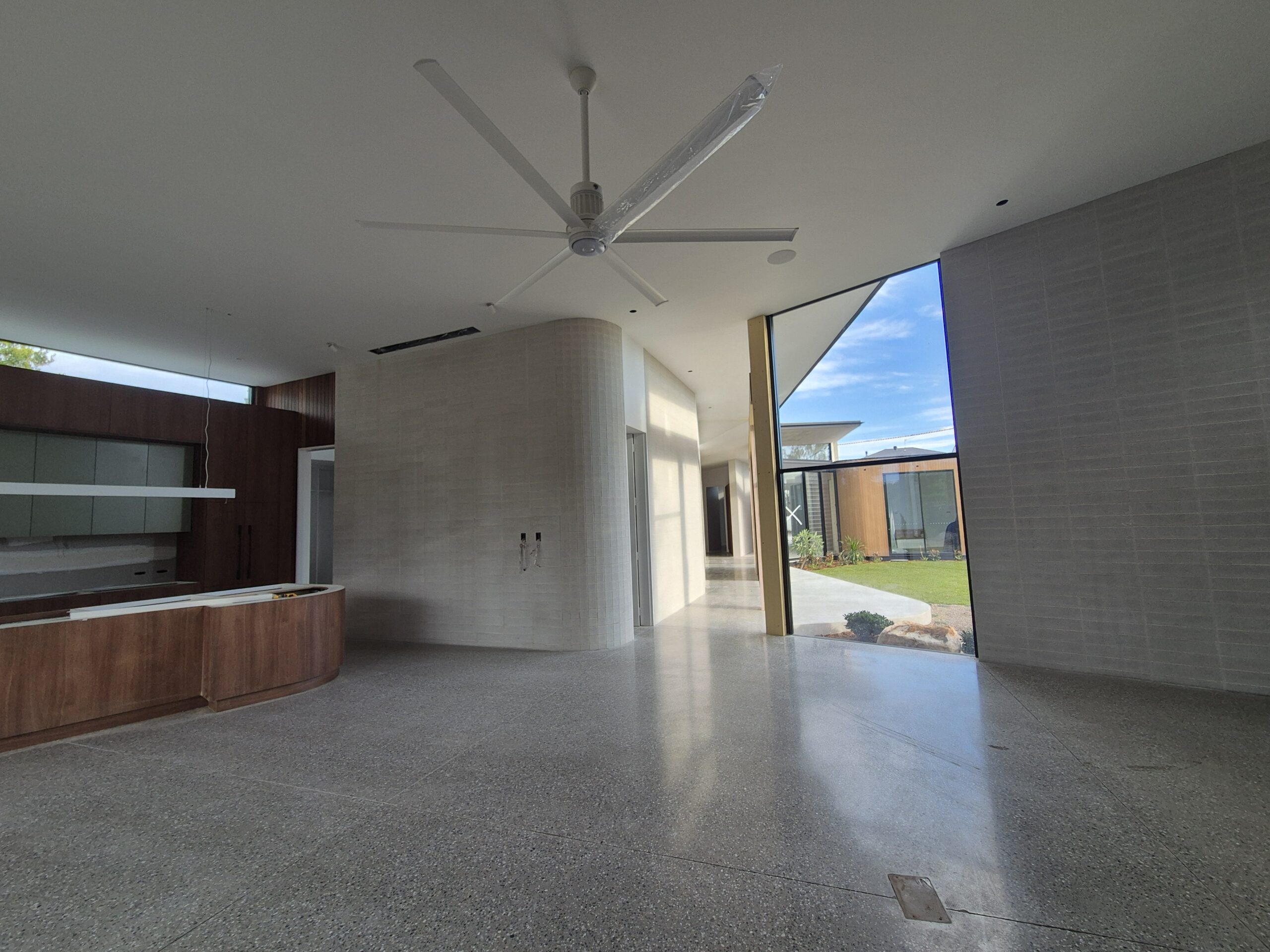 Matte satin 400 grit mechanically polished concrete indoor floor for a coastal residential property in Culburra Beach.