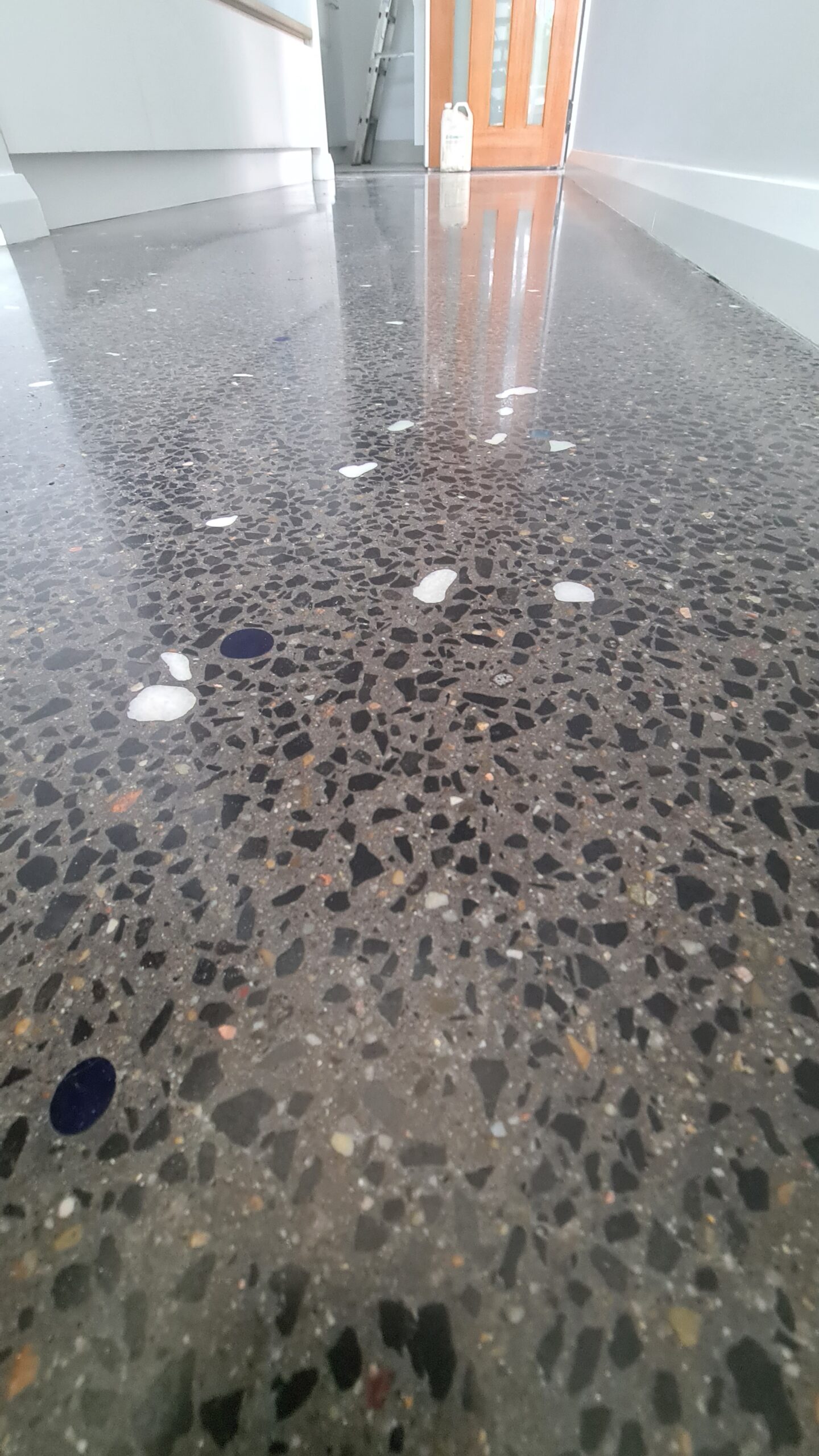 Satin finish 800 grit mechanically polished concrete internal floor for a modern residential layout in Wollongong.