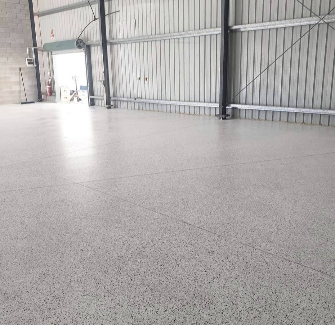 Commercial non-slip epoxy flooring installed in a Shell Cove garage by ProSand.
